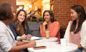 Diverse group of adult women of different races meeting together.